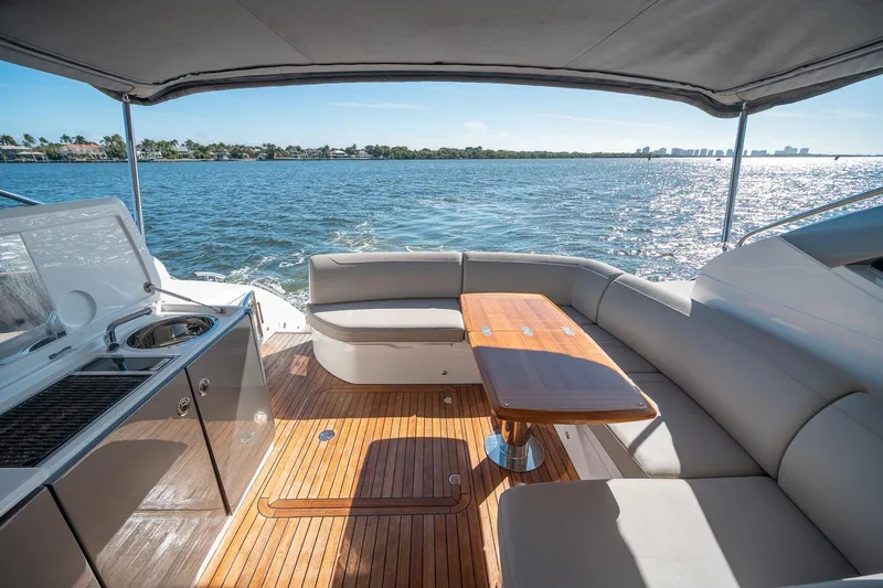 Bejul Yacht Photos Pics Luxurious 2021 Princess V40 yacht interior with elegant seating and scenic ocean view.