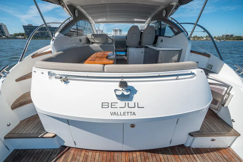 Bejul Yacht Photos Pics Luxury 2021 Princess V40 yacht interior with seating, table, and waterfront view.