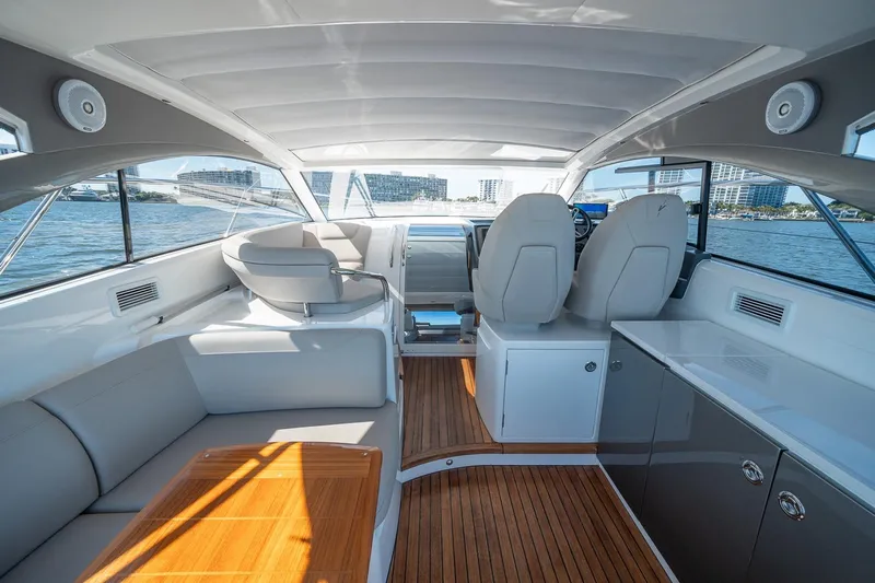 Bejul Yacht Photos Pics Interior of 2021 Princess V40 yacht with modern seating and wooden flooring.