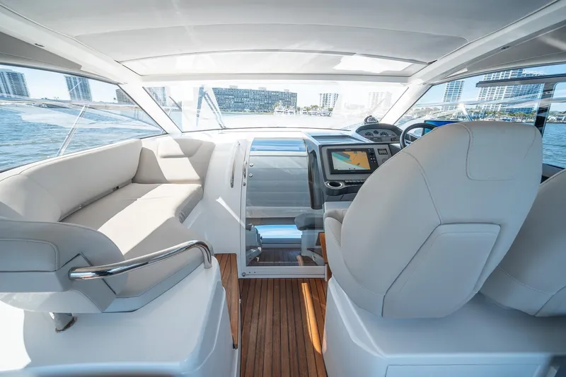 Bejul Yacht Photos Pics Interior of 2021 Princess V40 yacht with modern helm and seating area.