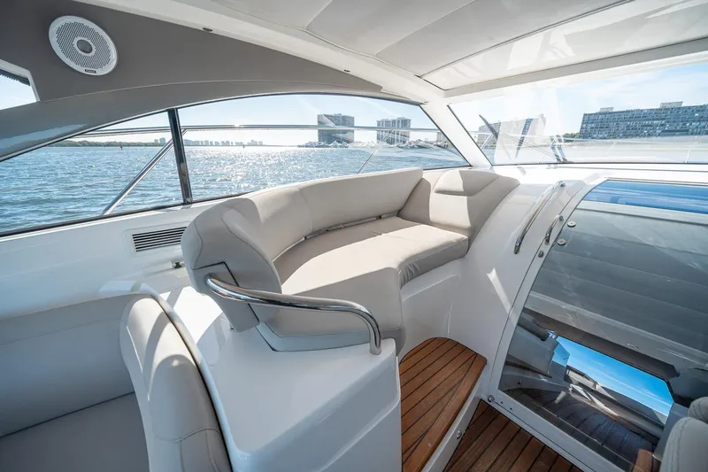 Bejul Yacht Photos Pics Luxurious 2021 Princess V40 yacht interior with elegant seating and scenic water view.