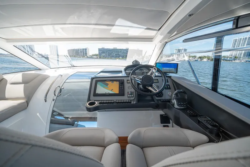 Bejul Yacht Photos Pics Interior view of 2021 Princess V40 yacht cockpit with modern navigation equipment.