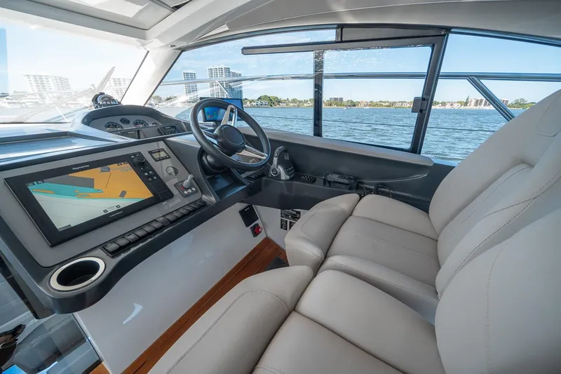 Bejul Yacht Photos Pics Interior of 2021 Princess V40 yacht with modern navigation system and luxurious seating.