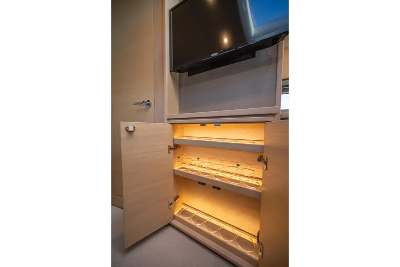 Bejul Yacht Photos Pics Illuminated cabinet with glass holders in 2021 Princess V40 yacht interior.
