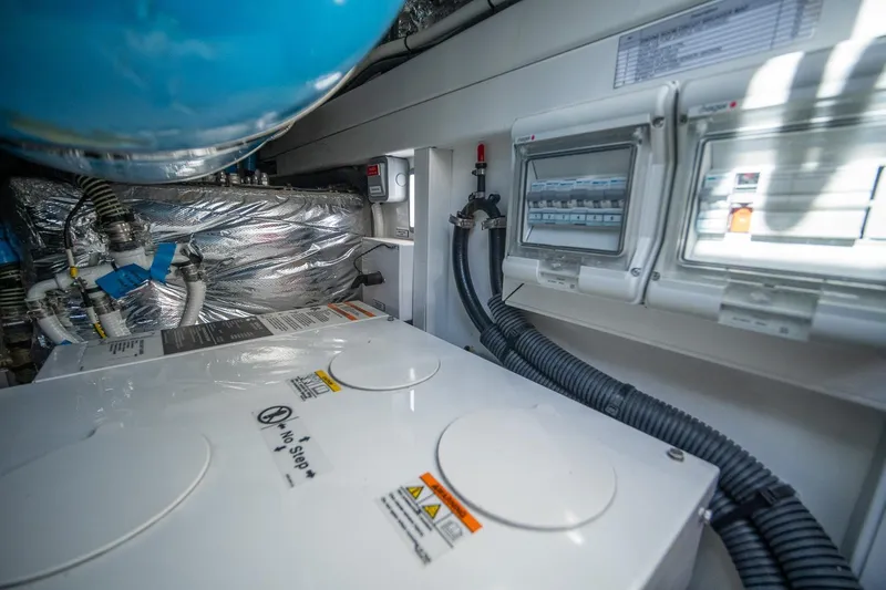 Bejul Yacht Photos Pics Engine room of 2021 Princess V40 yacht with control panels and wiring.