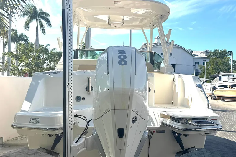 Blue Horizons II Yacht Photos Pics 2023 Boston Whaler 240 Vantage boat with powerful 300 horsepower engine, docked outdoors.