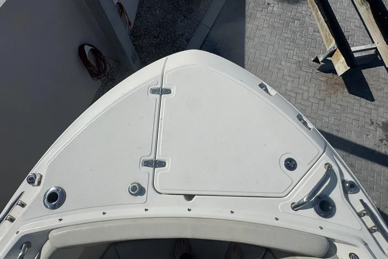 Blue Horizons II Yacht Photos Pics 2023 Boston Whaler 240 Vantage boat bow with storage compartments and fittings.