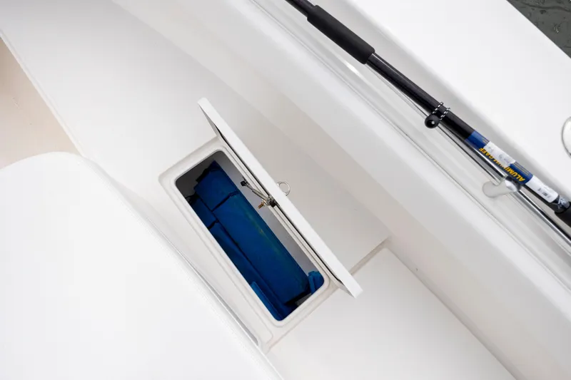  Yacht Photos Pics Storage compartment on 2023 Contender 32 ST boat with fishing rod holder.
