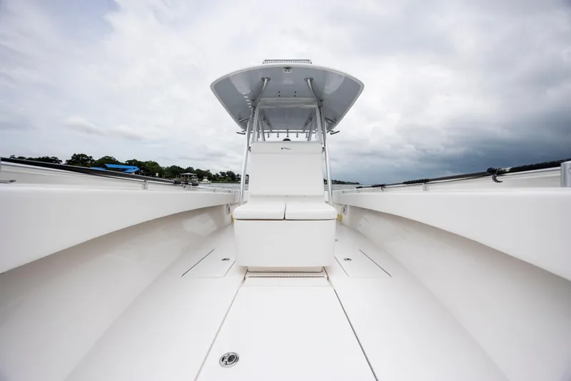  Yacht Photos Pics 2023 Contender 32 ST boat with sleek white deck and modern design.