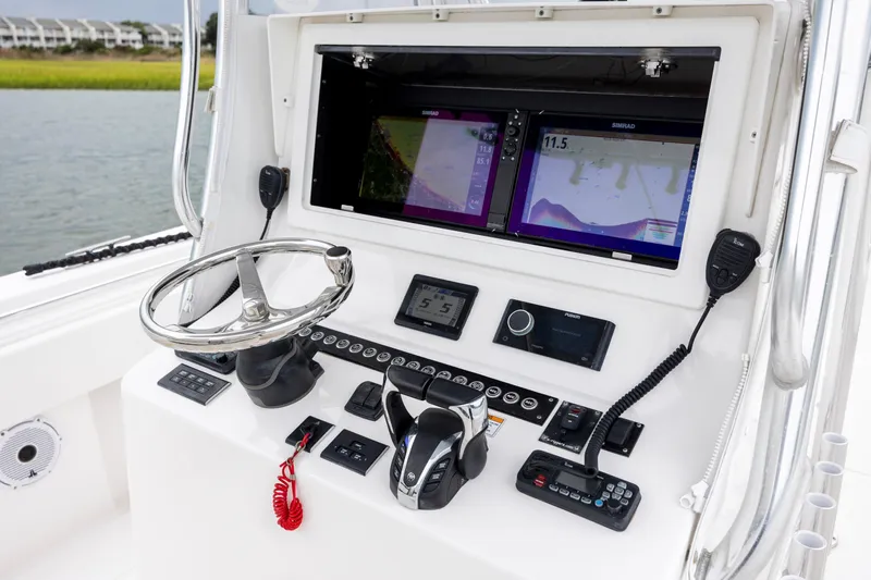  Yacht Photos Pics 2023 Contender 32 ST boat dashboard with advanced navigation and control systems.