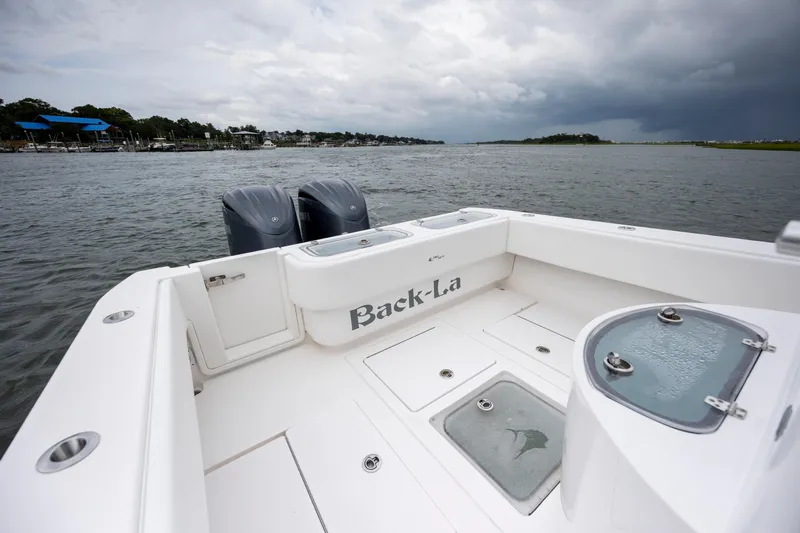  Yacht Photos Pics 2023 Contender 32 ST boat on water, featuring dual engines and spacious deck.