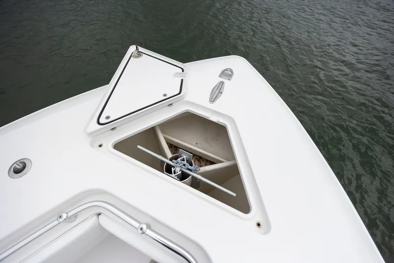  Yacht Photos Pics 2023 Contender 32 ST boat anchor compartment open on calm water.