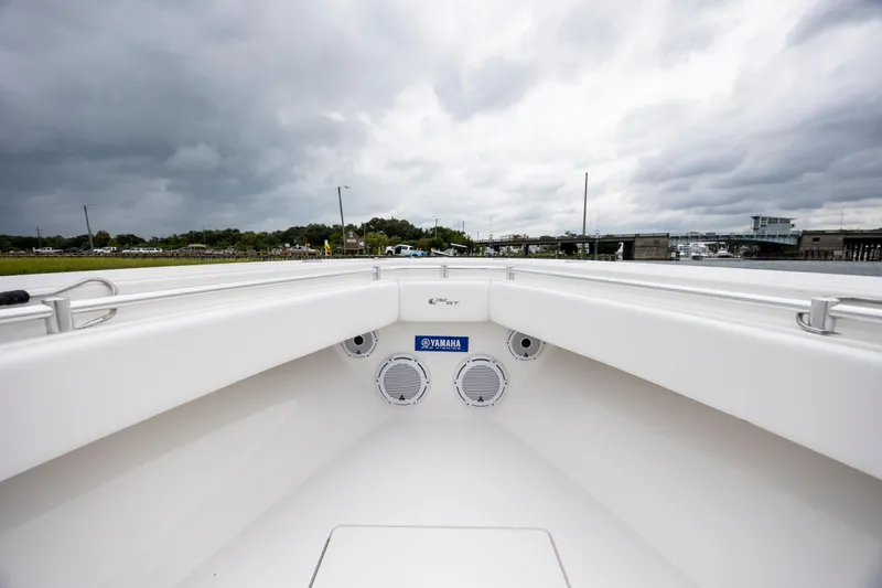  Yacht Photos Pics 2023 Contender 32 ST boat interior with Yamaha speakers, under cloudy sky.
