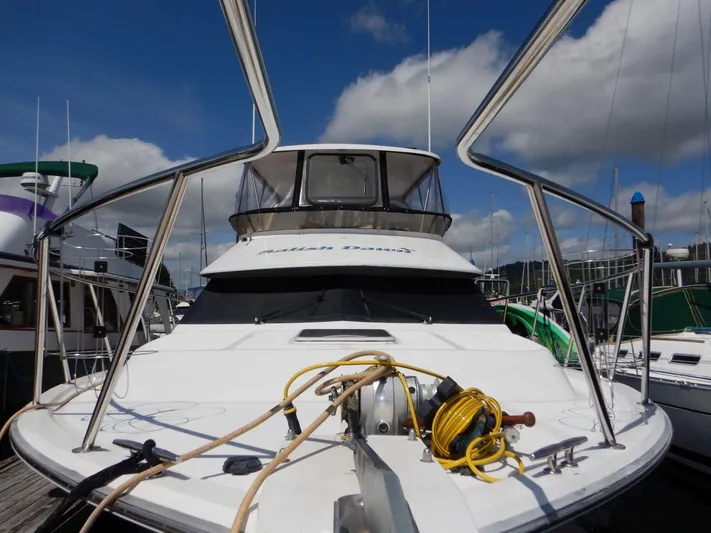  Yacht Photos Pics 1990 Ocean Alexander 440 Sundeck CPMY yacht docked, featuring spacious deck and clear skies.