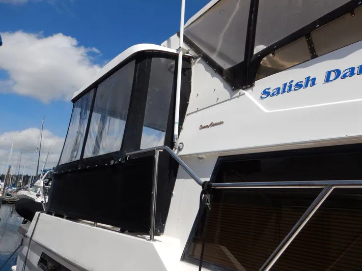  Yacht Photos Pics 1990 Ocean Alexander 440 Sundeck CPMY yacht docked under blue sky.