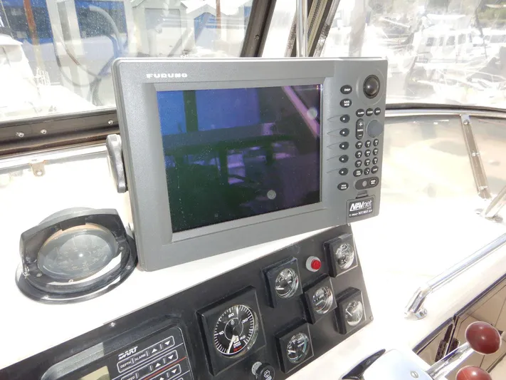  Yacht Photos Pics 1990 Ocean Alexander 440 Sundeck CPMY helm with Furuno navigation system and control panel.