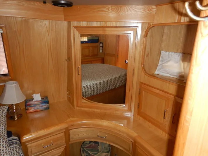  Yacht Photos Pics 1990 Ocean Alexander 440 Sundeck CPMY interior with wooden cabinetry and mirror.