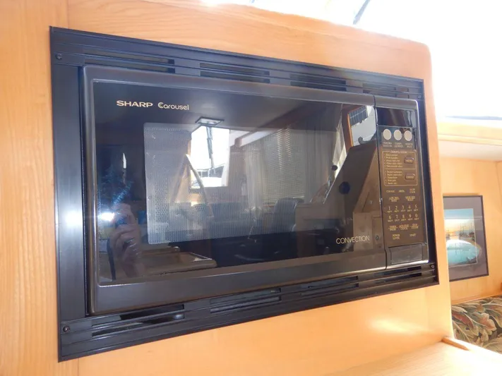  Yacht Photos Pics Sharp Carousel microwave in 1990 Ocean Alexander 440 Sundeck CPMY yacht interior.