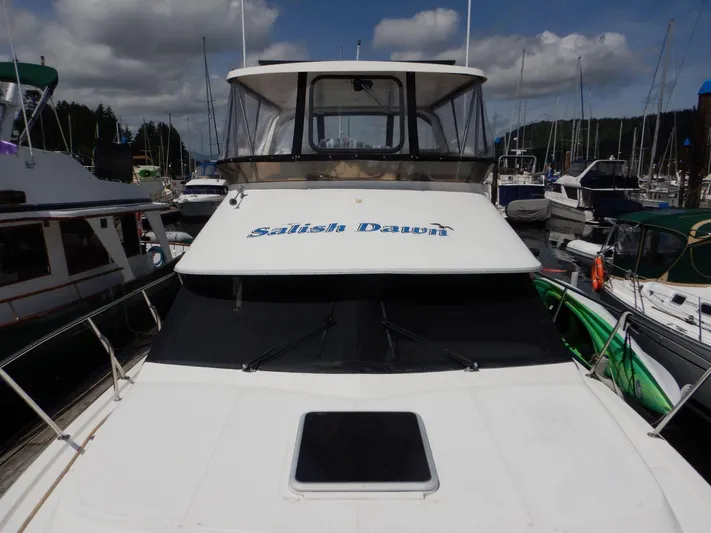 Yacht Photos Pics 1990 Ocean Alexander 440 Sundeck CPMY yacht docked in a marina.