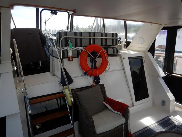  Yacht Photos Pics 1990 Ocean Alexander 440 Sundeck CPMY interior with seating and life preserver.