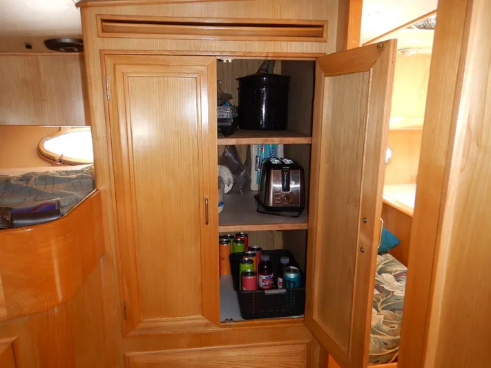  Yacht Photos Pics 1990 Ocean Alexander 440 Sundeck CPMY interior cabinet with kitchen appliances and canned beverages.