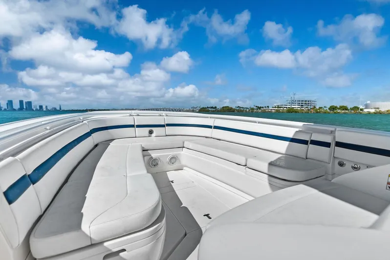 Double Trouble Yacht Photos Pics 2017 Intrepid 327 Center Console boat with spacious seating, cruising on a sunny day.