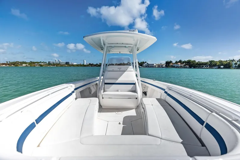 Double Trouble Yacht Photos Pics 2017 Intrepid 327 Center Console boat on clear blue water under a sunny sky.