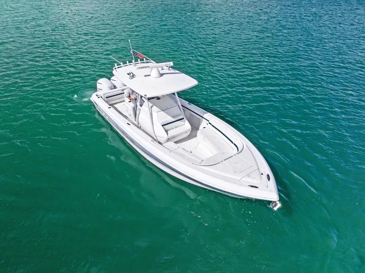 Double Trouble Yacht Photos Pics 2017 Intrepid 327 Center Console boat on clear blue water.