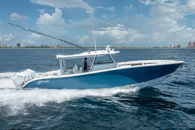  Yacht Photos Pics 2025 Yellowfin 42 Offshore boat cruising on open water under a clear sky.