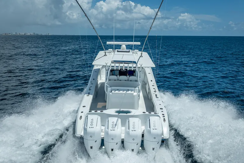  Yacht Photos Pics 2025 Yellowfin 42 Offshore boat cruising on open ocean with powerful engines.