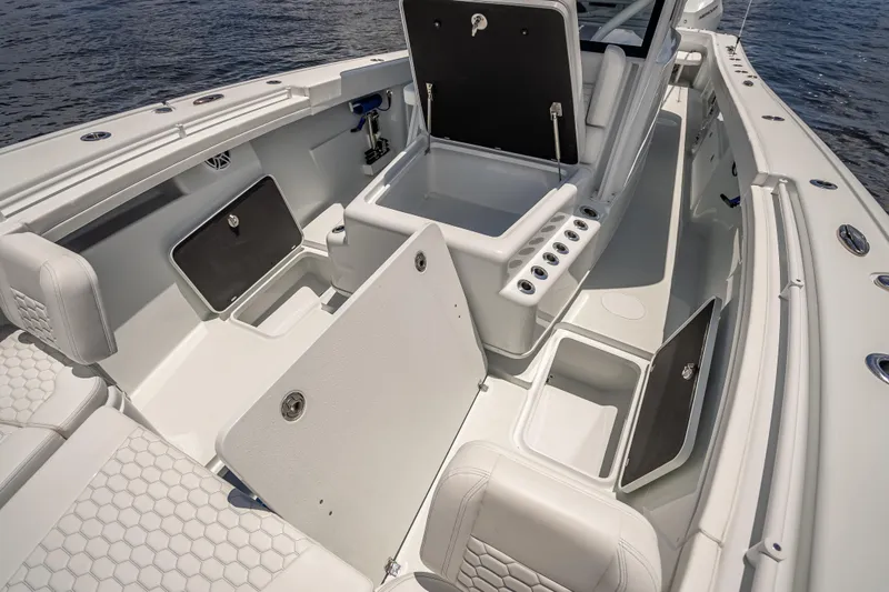  Yacht Photos Pics 2025 Yellowfin 42 Offshore boat interior with open storage compartments and seating.