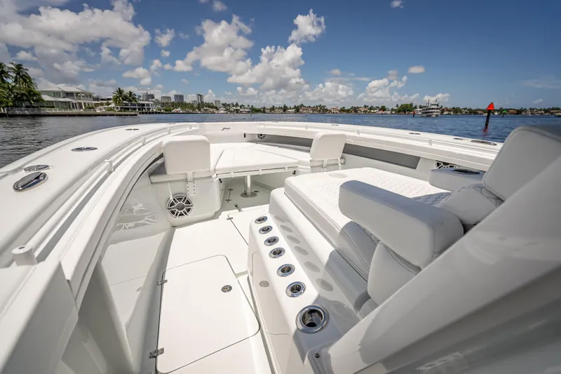  Yacht Photos Pics 2025 Yellowfin 42 Offshore boat interior with luxurious seating and ocean view.