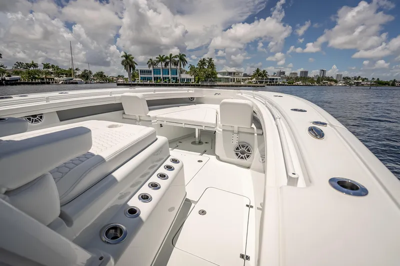  Yacht Photos Pics 2025 Yellowfin 42 Offshore boat interior with luxurious seating and ocean view.