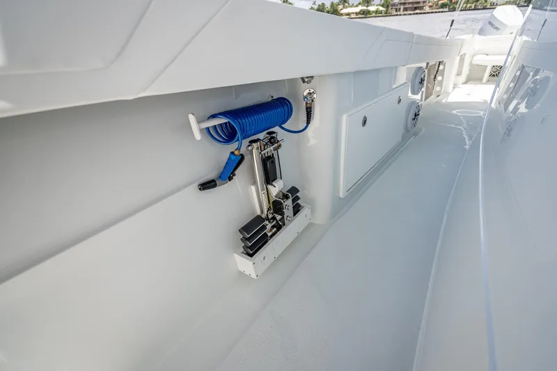  Yacht Photos Pics 2025 Yellowfin 42 Offshore boat deck with coiled hose and storage compartments.