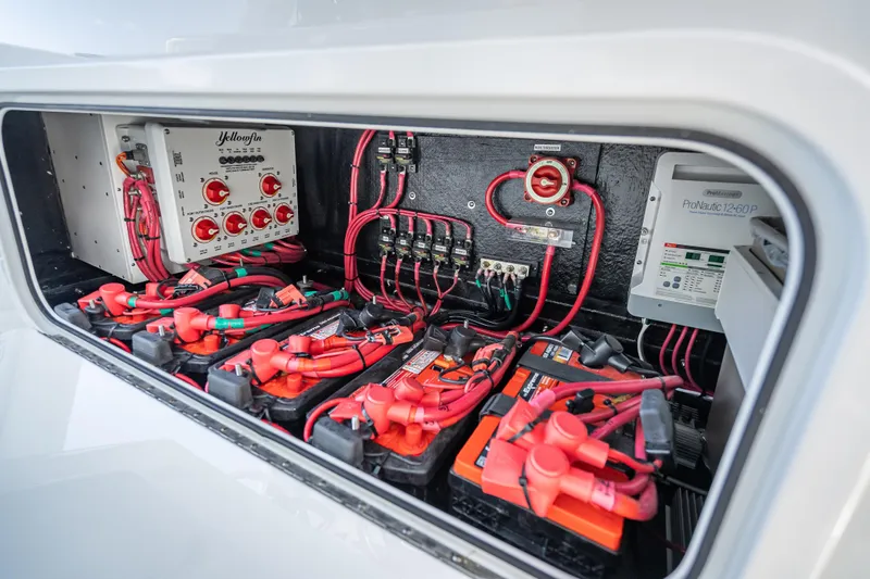  Yacht Photos Pics Electrical system of 2025 Yellowfin 42 Offshore boat, featuring batteries and wiring.