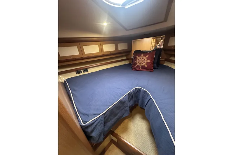 Pallavisino Yacht Photos Pics Luxurious cabin interior of 2007 Mochi Craft 44 Dolphin yacht with nautical-themed decor.