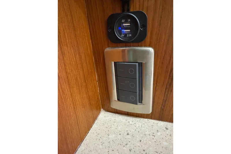  Yacht Photos Pics USB charging ports and light switches on a 2007 Tiara 43 yacht interior.