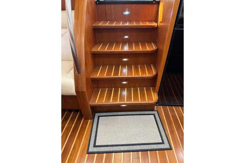  Yacht Photos Pics Wooden stairs with lighting on a 2007 Tiara 43 yacht interior.
