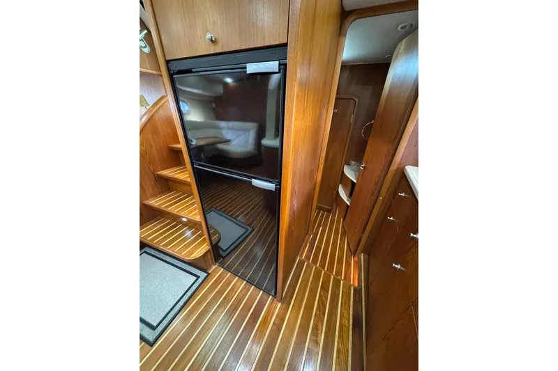 Yacht Photos Pics 2007 Tiara 43 yacht interior with wooden flooring and cabinetry.