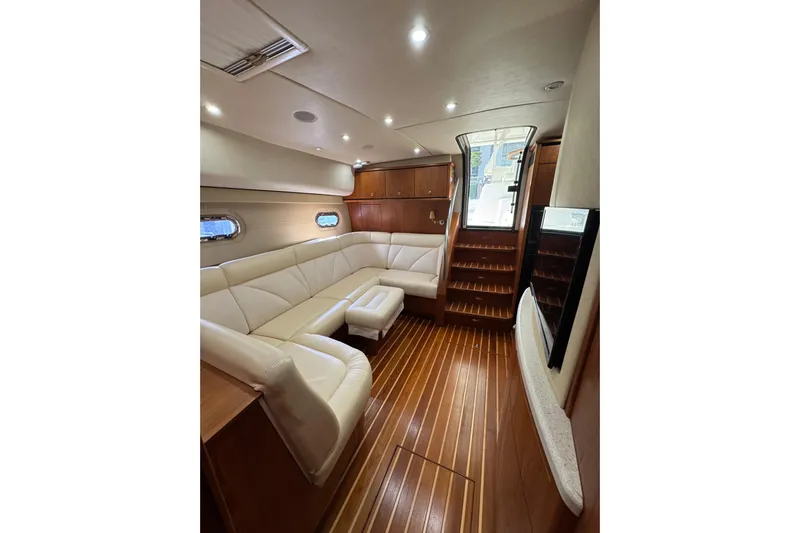  Yacht Photos Pics Luxurious interior of 2007 Tiara 43 yacht with elegant seating and wooden flooring.