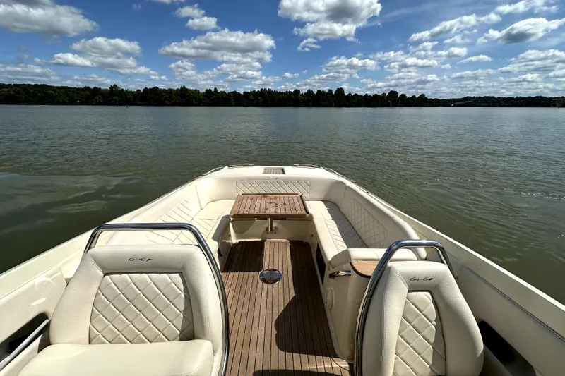  Yacht Photos Pics 2019 Chris-Craft Launch 30 boat interior with elegant seating on a serene lake.