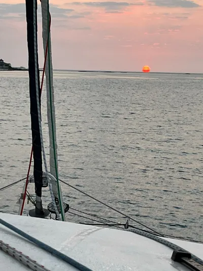 Ikati Yacht Photos Pics Sailboat Leopard 39 at sunset on calm sea, 2011.