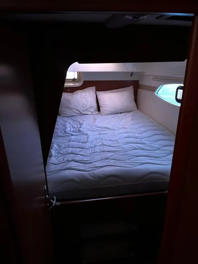 Ikati Yacht Photos Pics Cozy cabin bedroom in 2011 Leopard 39 yacht with pillows and natural light.