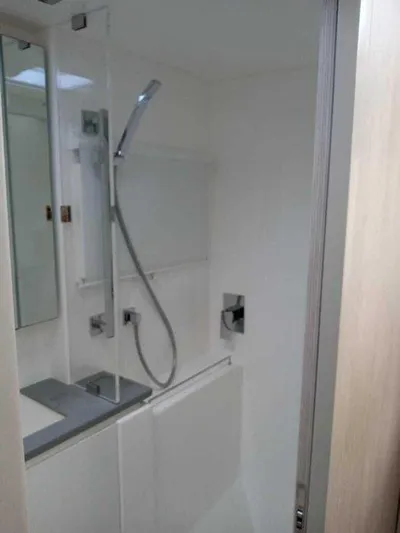 Rockin U Yacht Photos Pics Bathroom interior of 2020 Leopard 43 Powercat, featuring modern shower and sleek design.