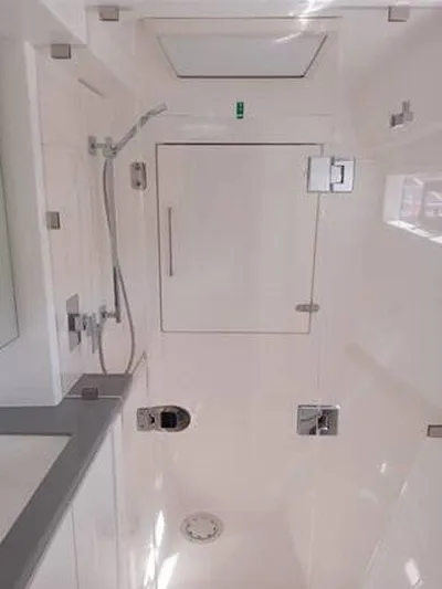 Rockin U Yacht Photos Pics Bathroom interior of 2020 Leopard 43 Powercat, featuring modern shower and sleek design.