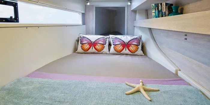 Rockin U Yacht Photos Pics Cozy bedroom in 2020 Leopard 43 Powercat with butterfly pillows and starfish decor.