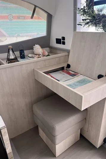 Rockin U Yacht Photos Pics Interior of 2020 Leopard 43 Powercat with storage bench and decorative items.