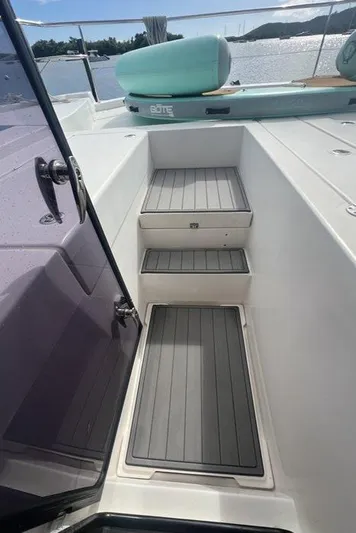 Rockin U Yacht Photos Pics Steps leading to deck on 2020 Leopard 43 Powercat yacht, with seating and water view.