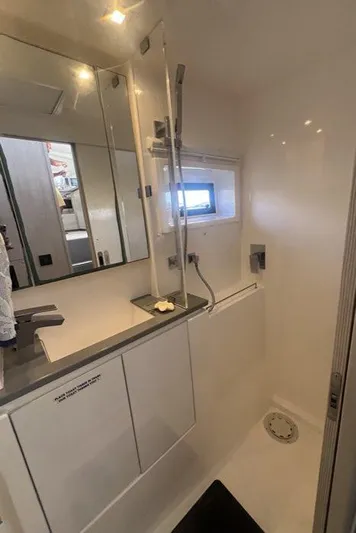 Rockin U Yacht Photos Pics Bathroom interior of 2020 Leopard 43 Powercat with modern fixtures and mirror.