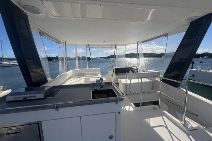 Rockin U Yacht Photos Pics 2020 Leopard 43 Powercat yacht interior with ocean view, featuring sleek design and modern amenities.